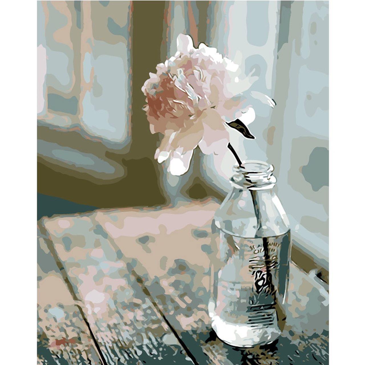 Flower in glass bottle